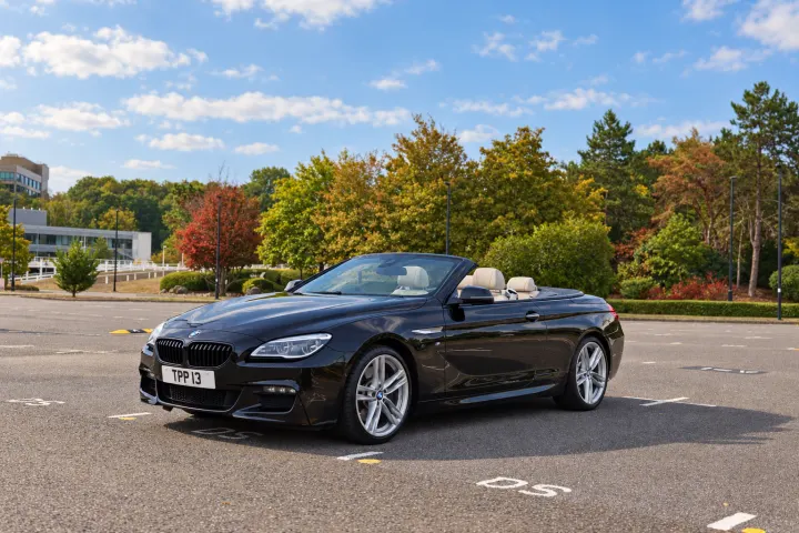 Front three-quarter, passenger side, roof down