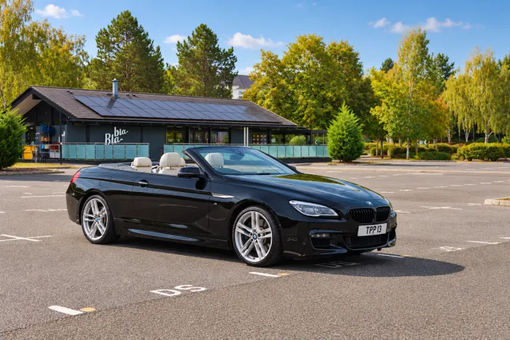 Front three-quarter, driver side, roof down