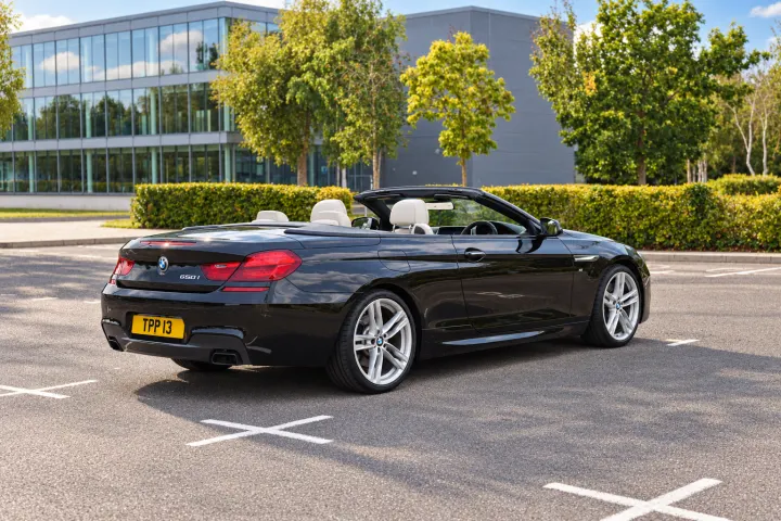 Rear three-quarter, driver side, roof down